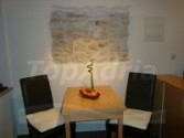 Charming interior with original stone wall decoration / Gemuetliches Ambient mit freigelegter Steinmauer